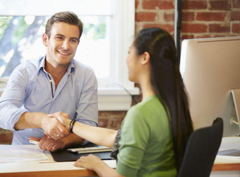 42307596 - businessman interviewing female job applicant in office